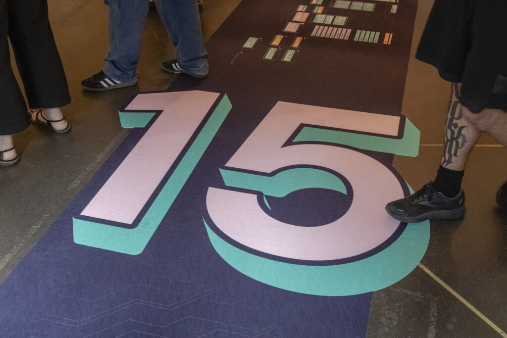 A rug with a large, colorful 15.