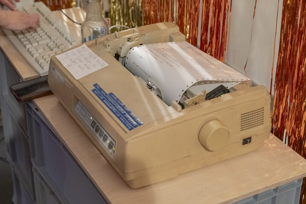 A dot matrix printer on a table.